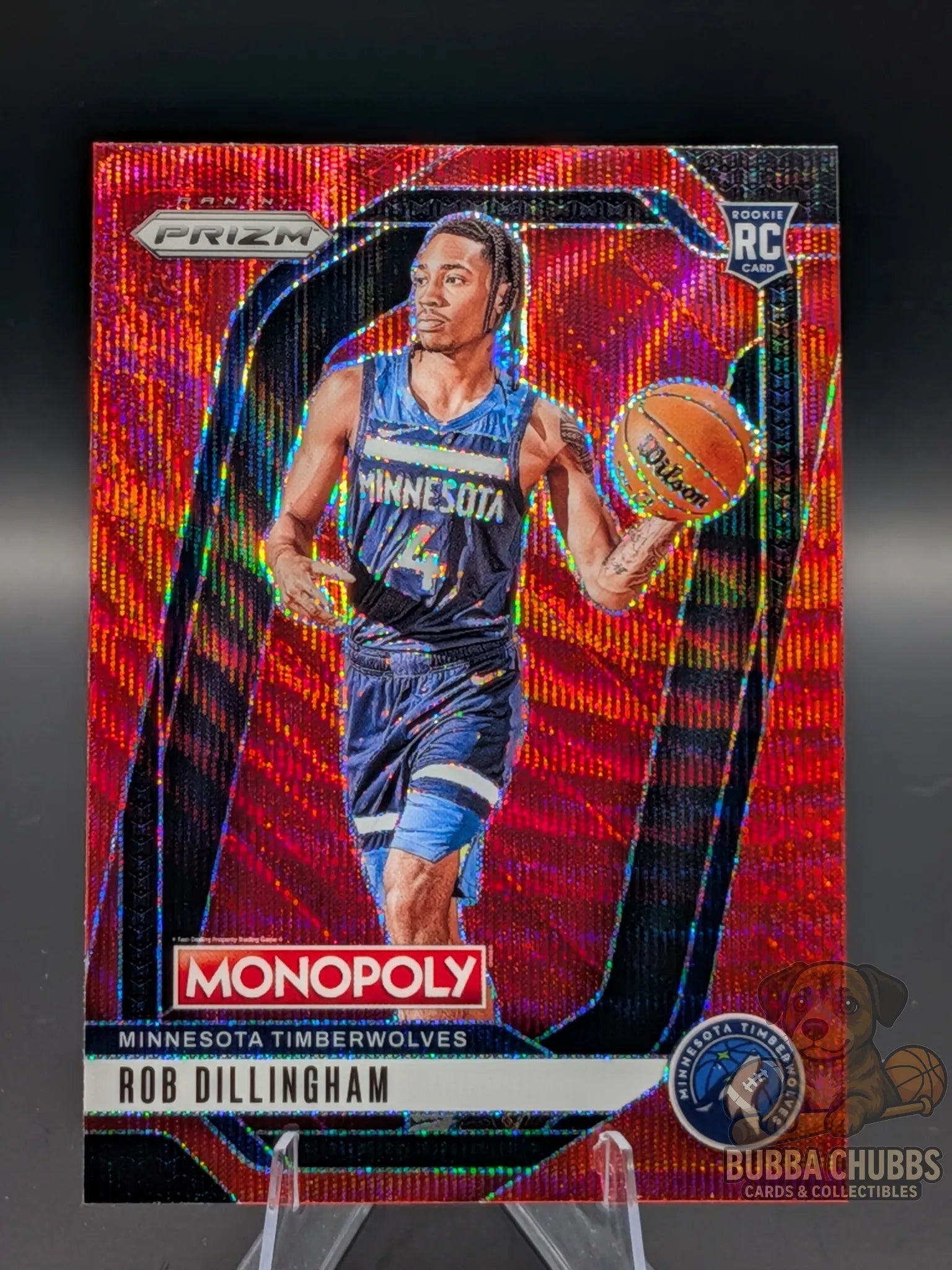 Basketball trading card featuring a basketball player rookie rob dillingham of the minnesota timberwolves panini prizm monopoly red shimmer parallel 