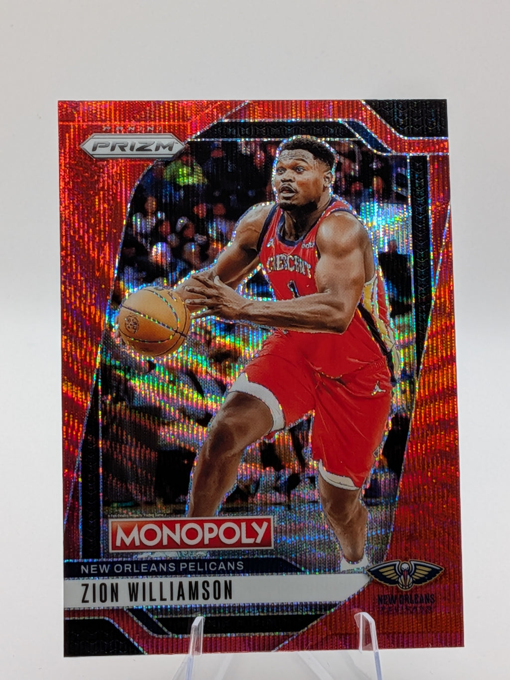 Basketball trading card of Zion Williamson of the New Orleans Pelicans panini prizm monopoly red parallel 