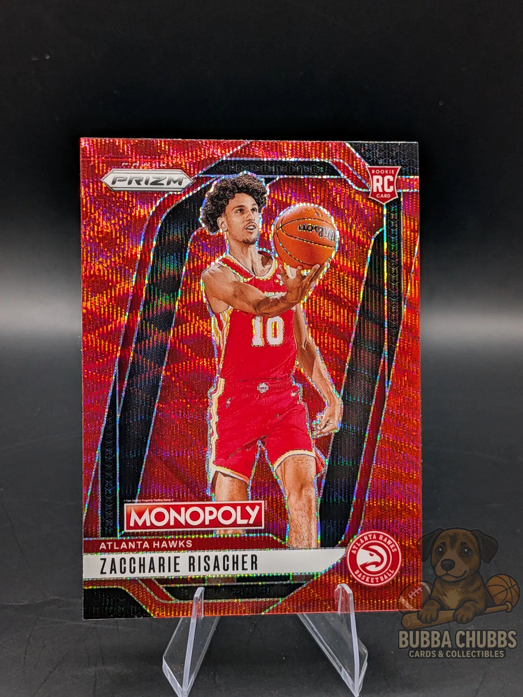 Basketball trading card of rookie zaccharie risacher of the Atlanta hawks panini prizm monopoly red shimmer parallel