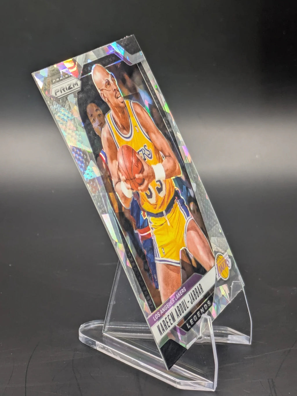 Basketball trading card of Kareem Abdul-Jabbar in a Los Angeles Lakers uniform Prizm Panini Legends