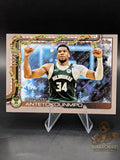 Basketball trading card of a player Giannis Antetokounmpo of the Bucks topps holiday glitter parallel
