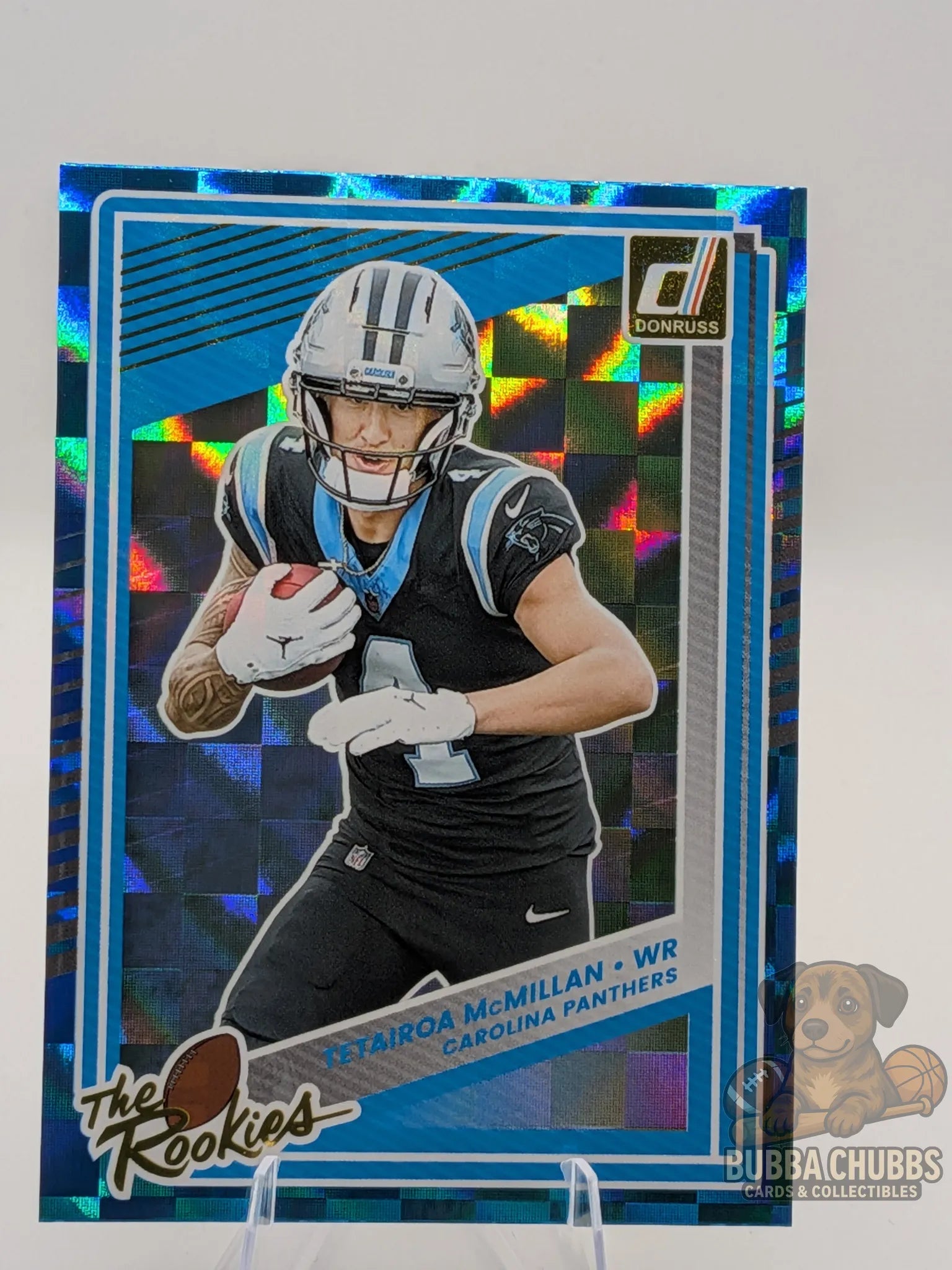 Football trading card of Tetairoa McMillan of the Carolina Panthers panini donruss the rookies blue foil holographic checkerboard parallel