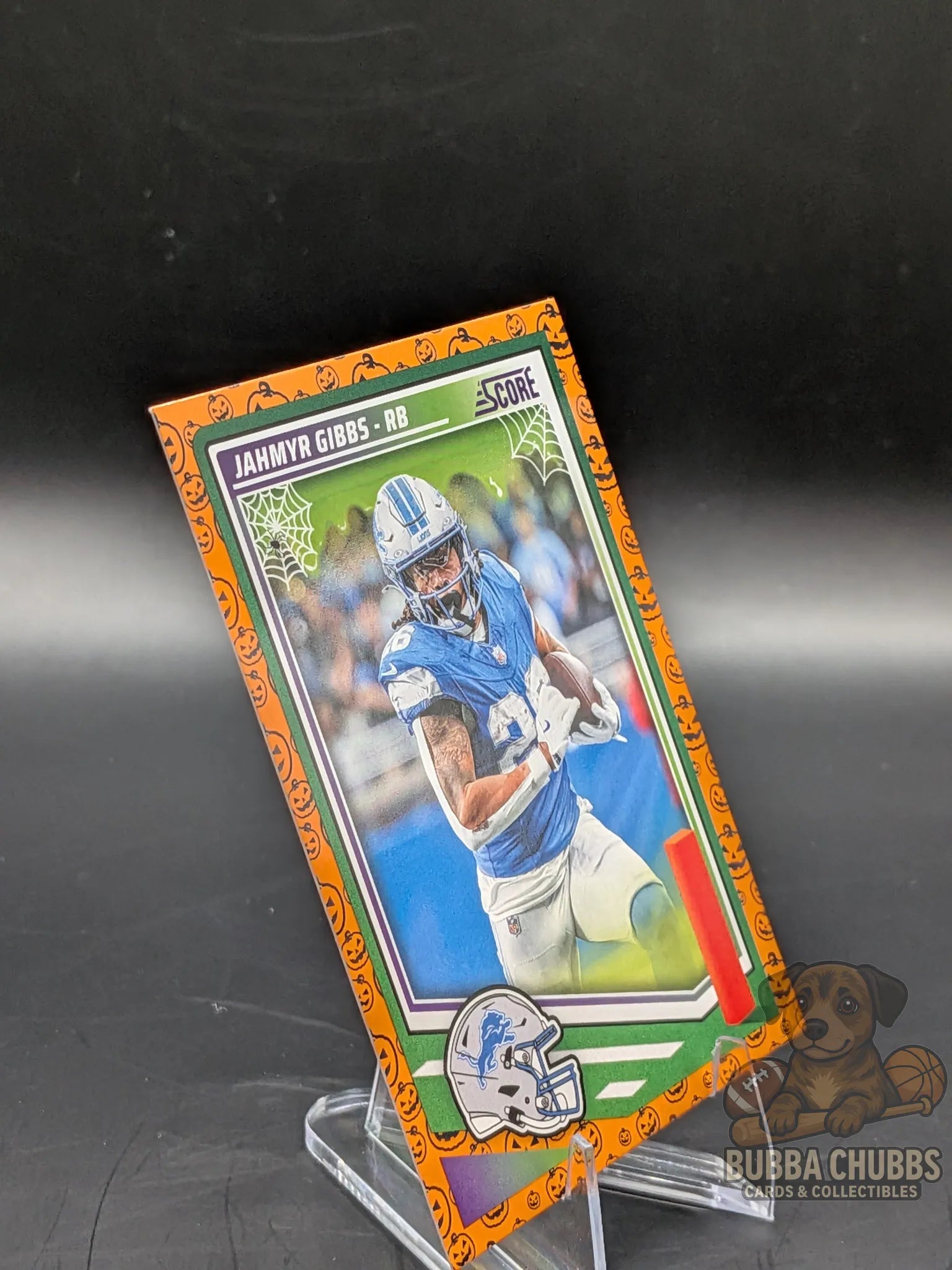 Football trading card of Jahmyr Gibbs of the Detroit Lyons panini score-a-treat halloween parallel