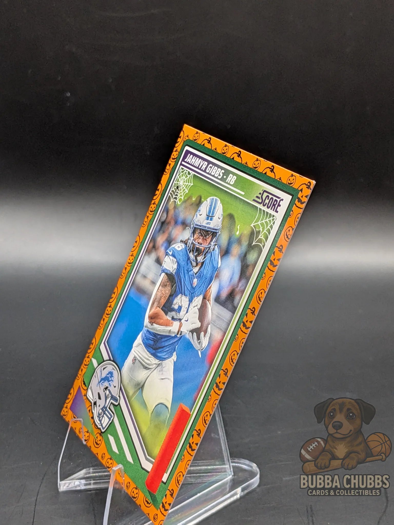 Football trading card of Jahmyr Gibbs of the Detroit Lyons panini score-a-treat halloween parallel